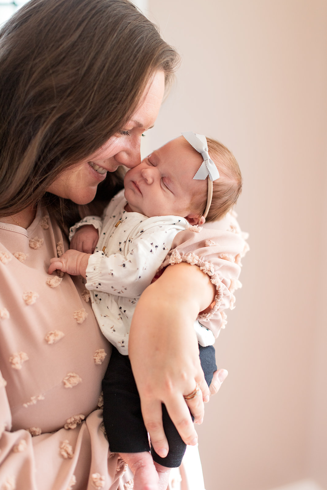 Mom holding newborn baby girl