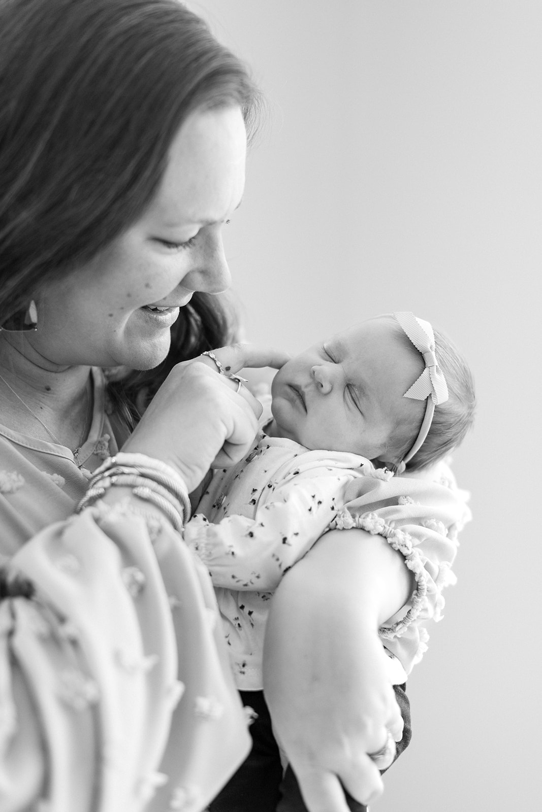 Mom holding newborn baby girl