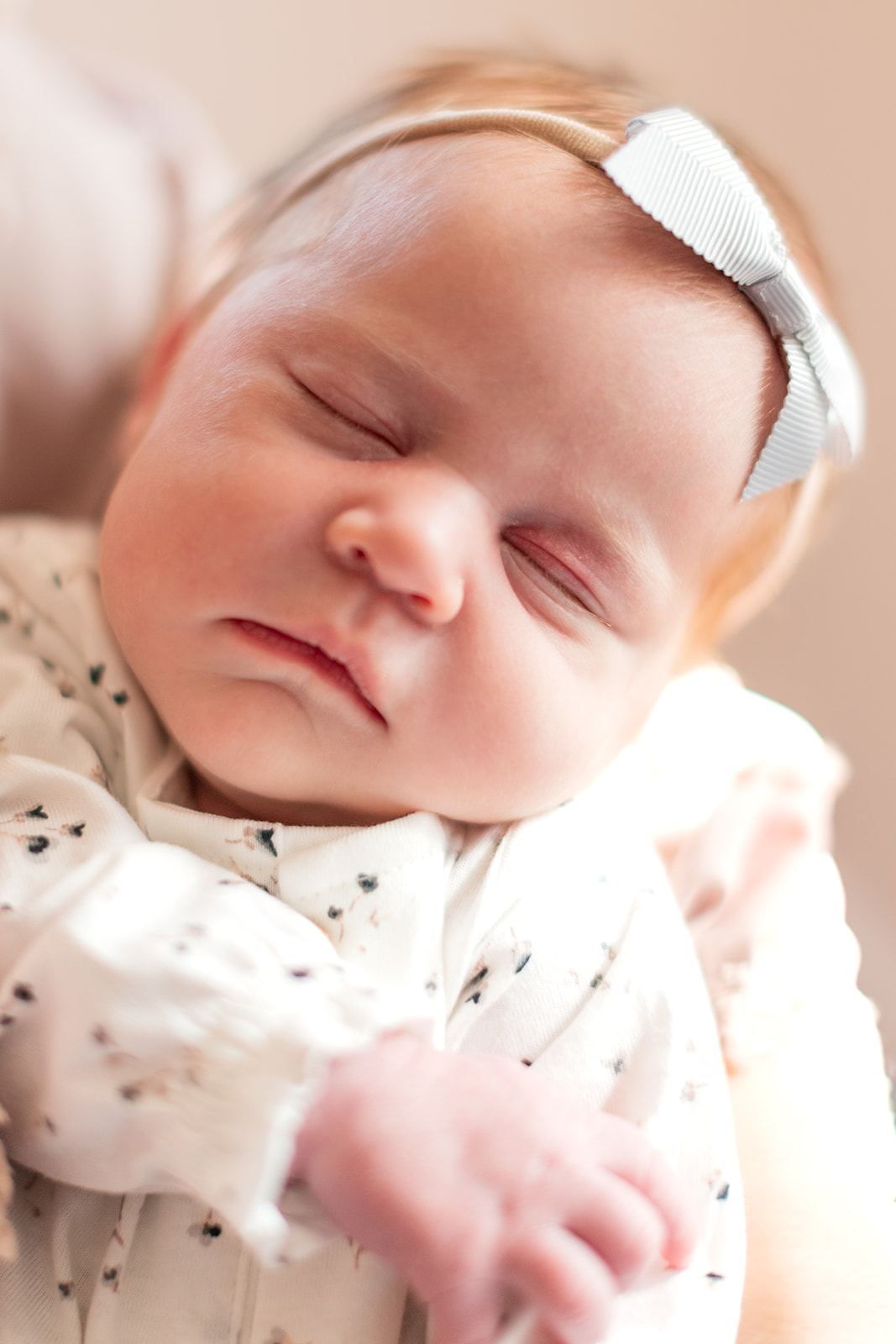 Close up of newborn baby girl during newborn photo session