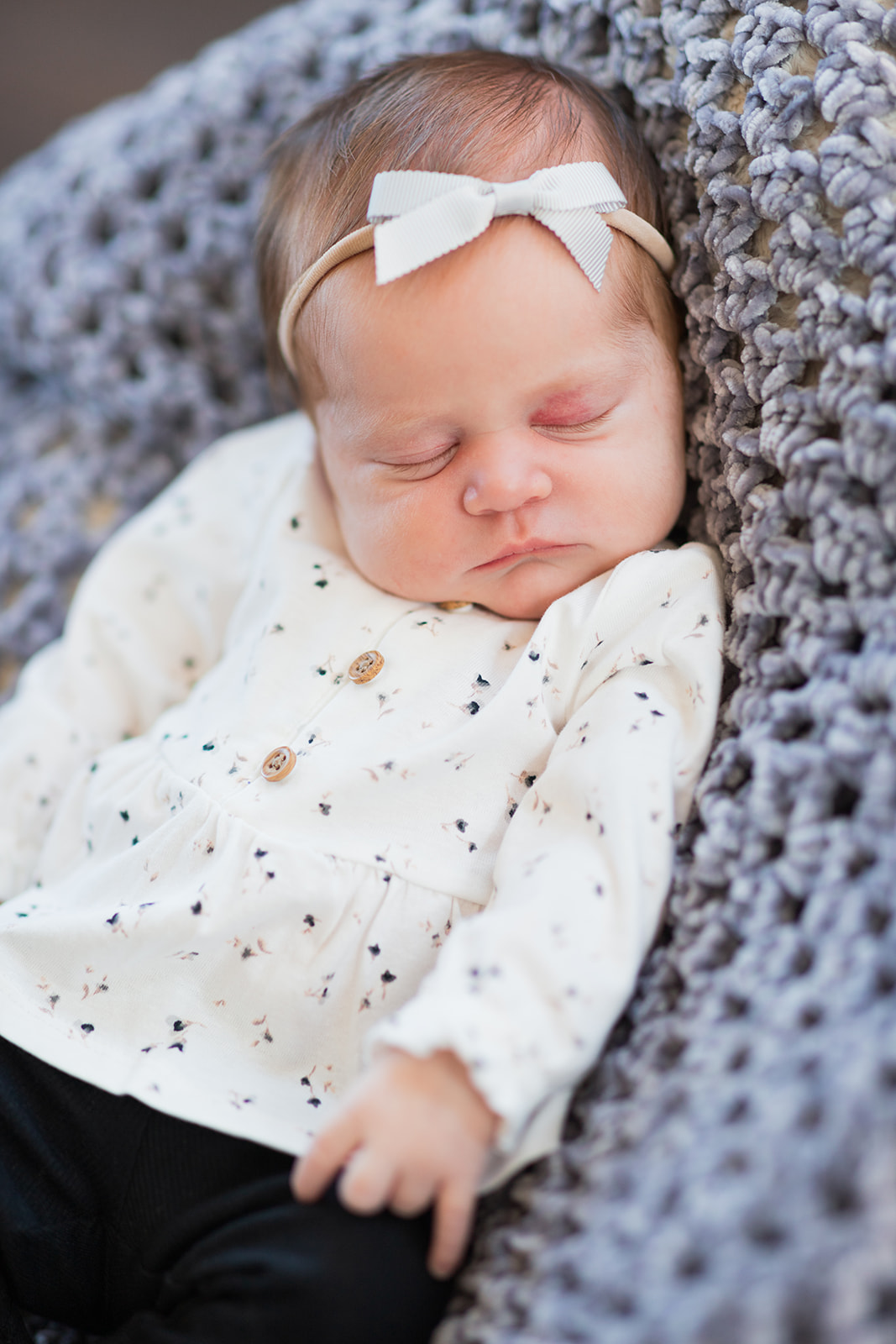 Baby Blair sleeping peacefully during newborn family photo session