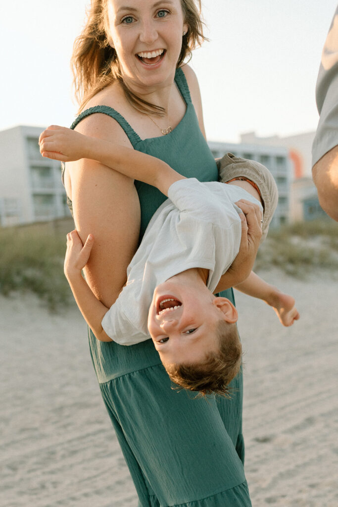 Candid mom and son moment during beach family photo session