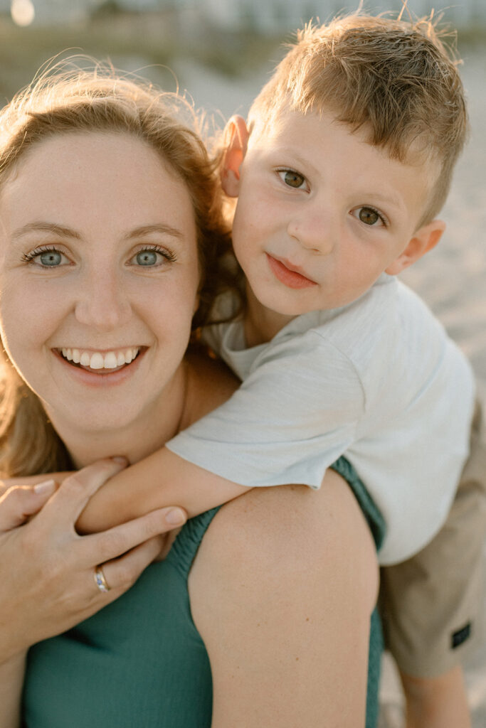 Intimate moment of mom holding baby close with wind in her hair