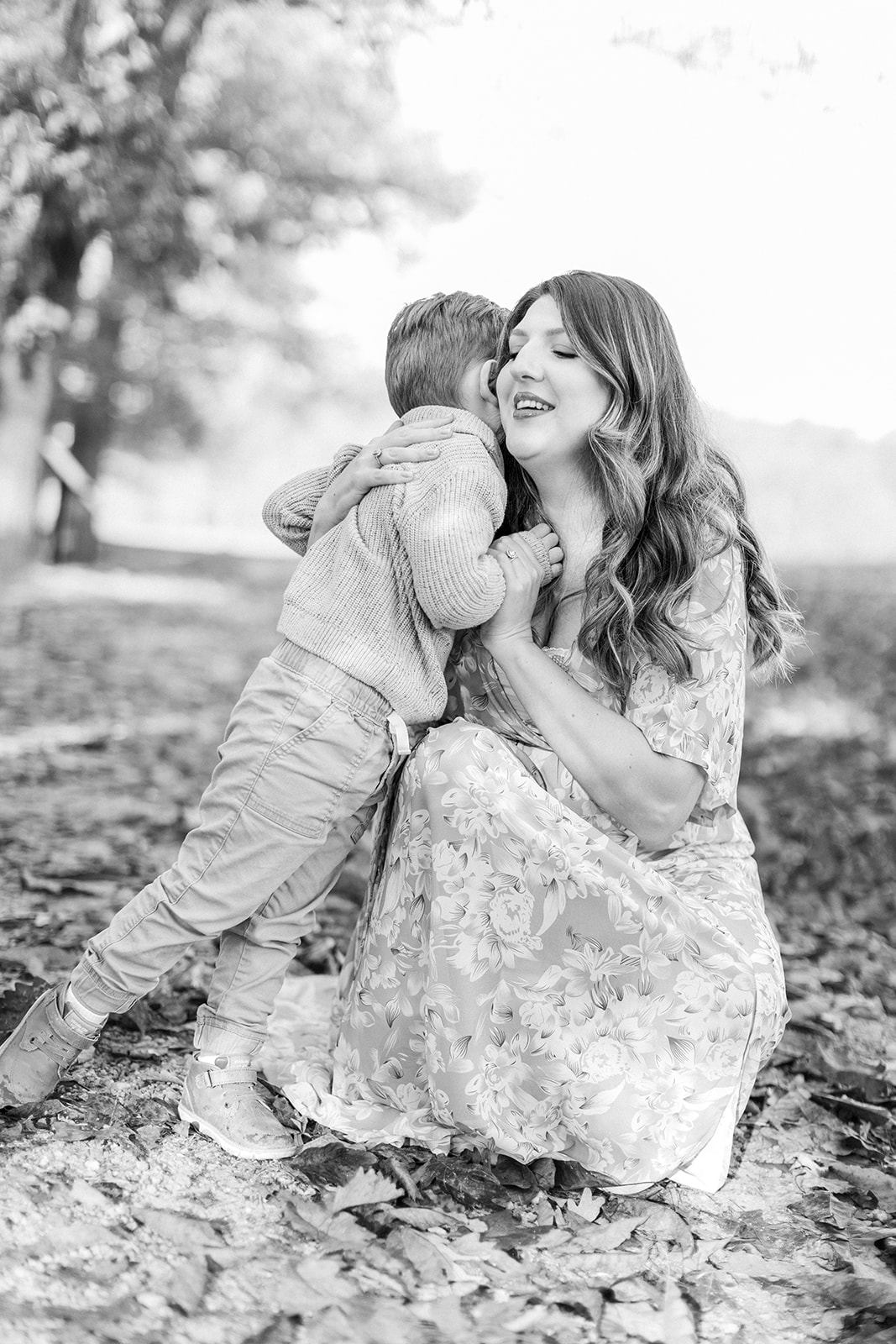 Toddler giving mom a hug and warm embrace in black and white photo
