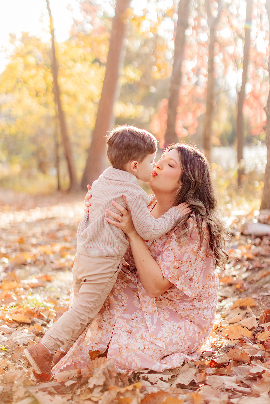 Family portraits with warm natural light and fall leaves at Murray’s Mill