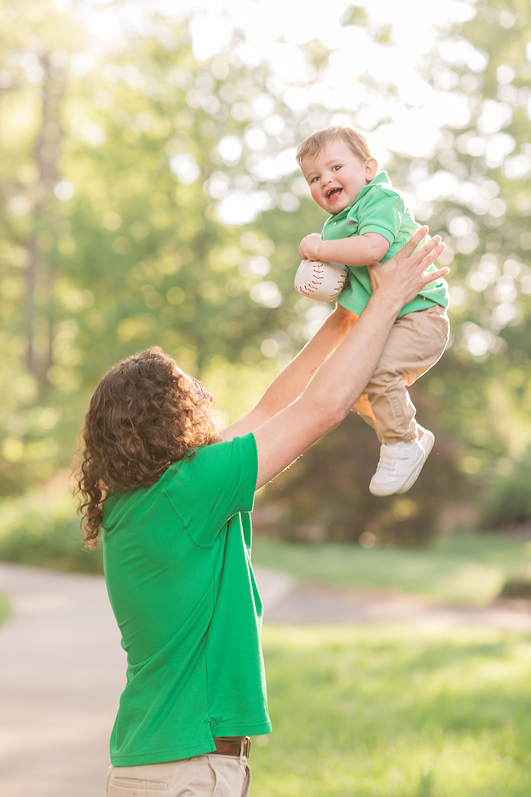 Father and son candid moment in the garden during a spring photo shoot