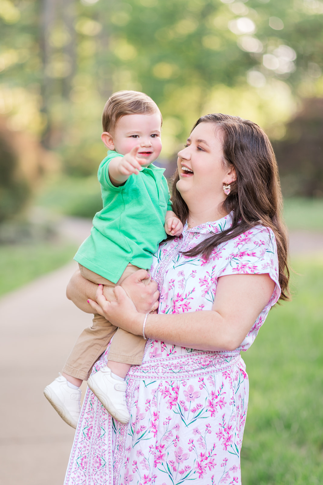 Catelyn holding Jack in front of spring florals in Rock Hill, SC