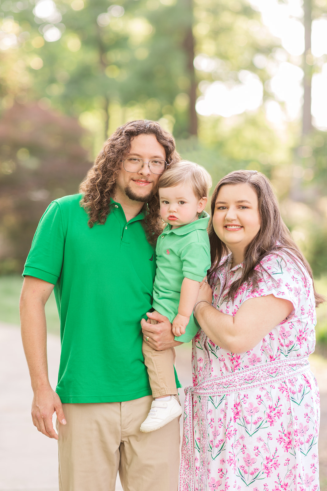Dylan and Catelyn holding Jack on a stone path at Glencairn Garden