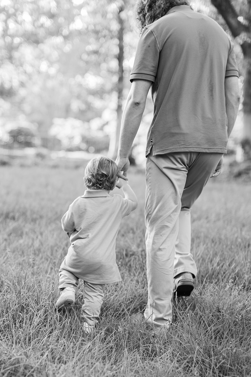 Jack exploring grass during spring family session in Rock Hill, South Carolina