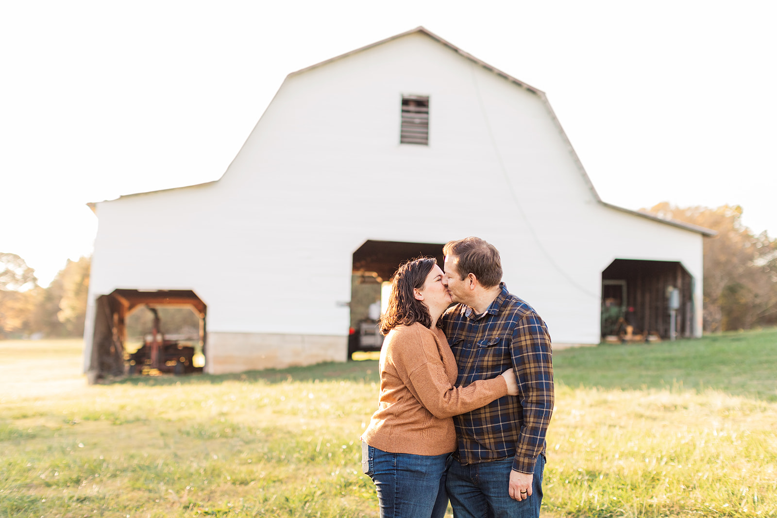 Parents embracing in front of murray's mill
