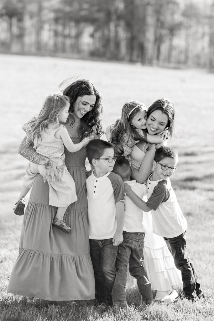 kids hugging aunt in black and white on family land in mocksville, nc 