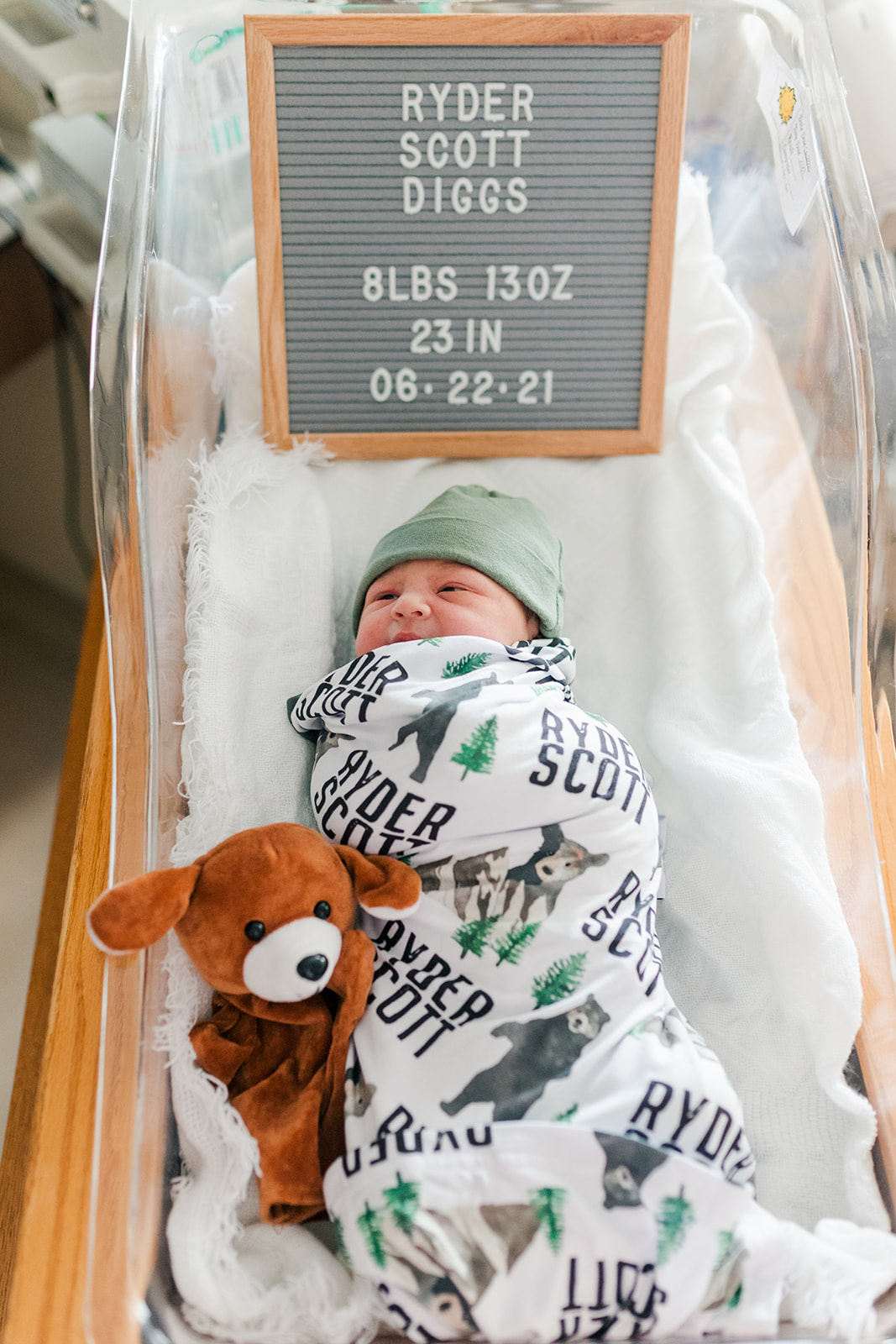 Newborn Ryder swaddled in a hospital bassinet just hours after birth