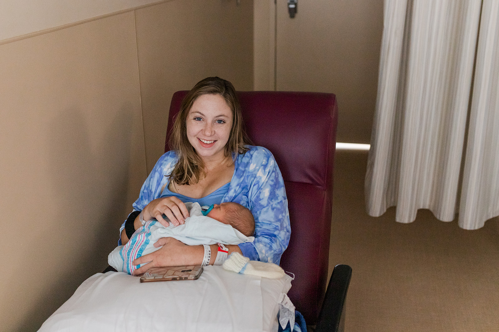 Hannah holding newborn Ryder in the hospital for the first time
