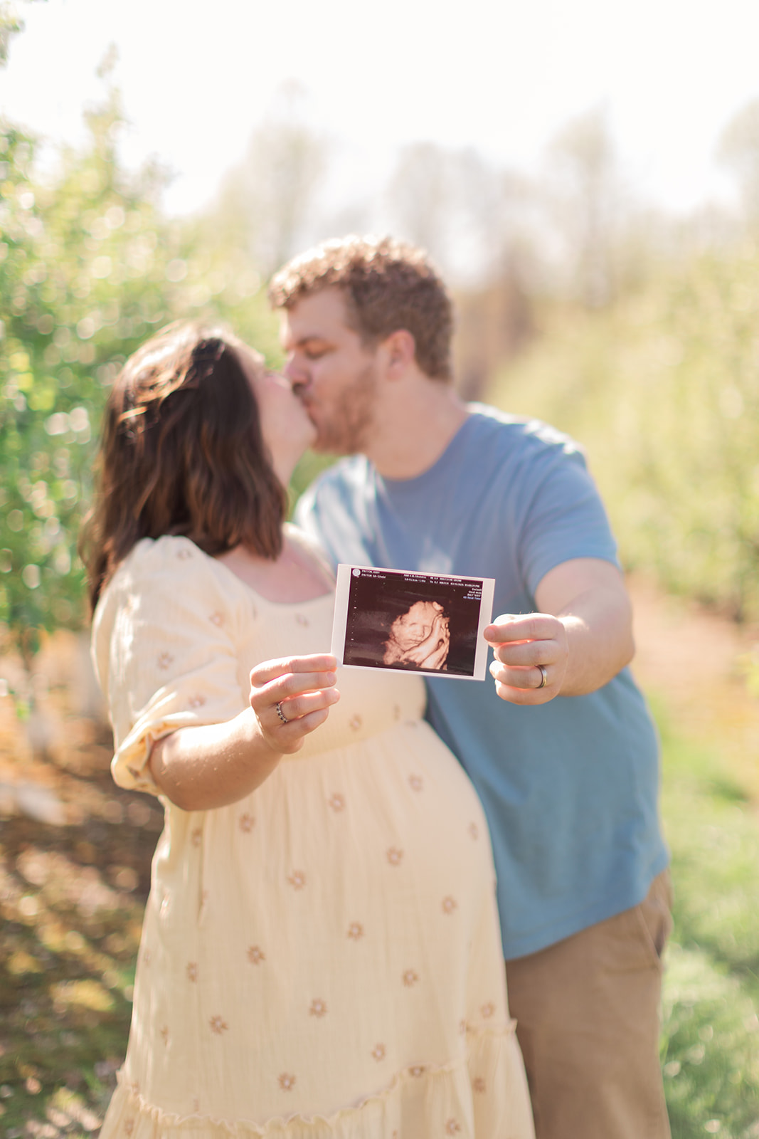 Gentle moment captured between expecting mom and her friend