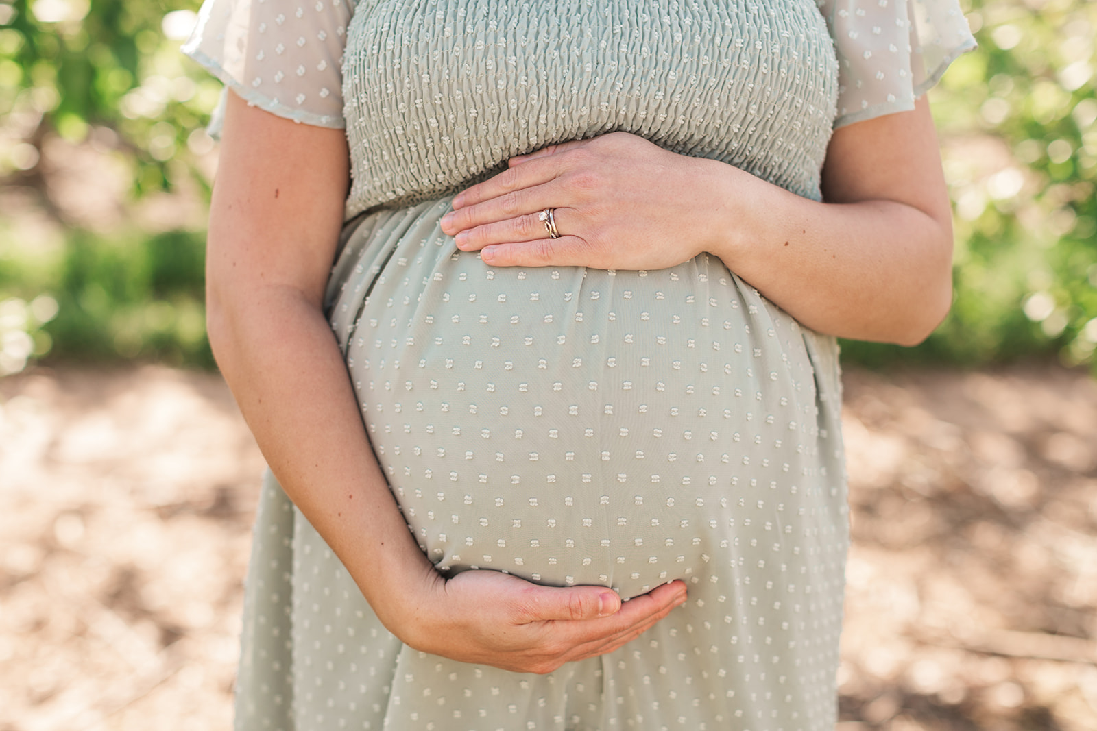 Close-up of baby bump during maternity photo session