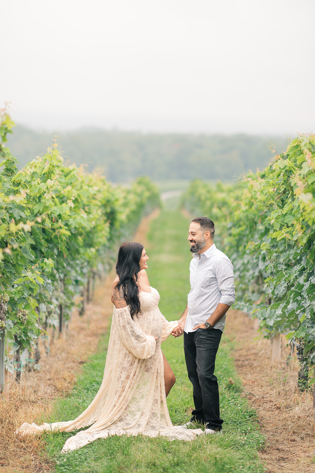 Couple framed by rolling hills at Raffaldini Vineyards