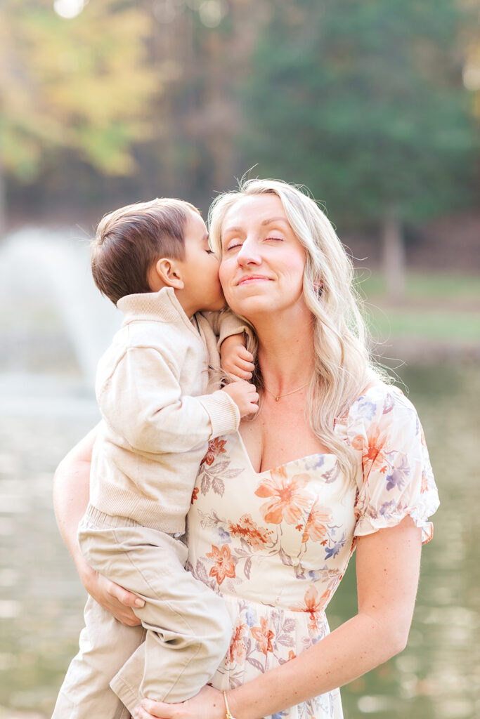 Lifestyle family moment by the water at golden hour