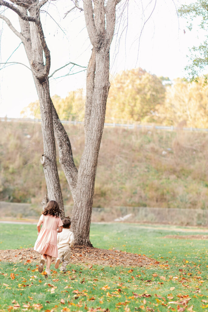 Kids playing near duck pond during family photo session