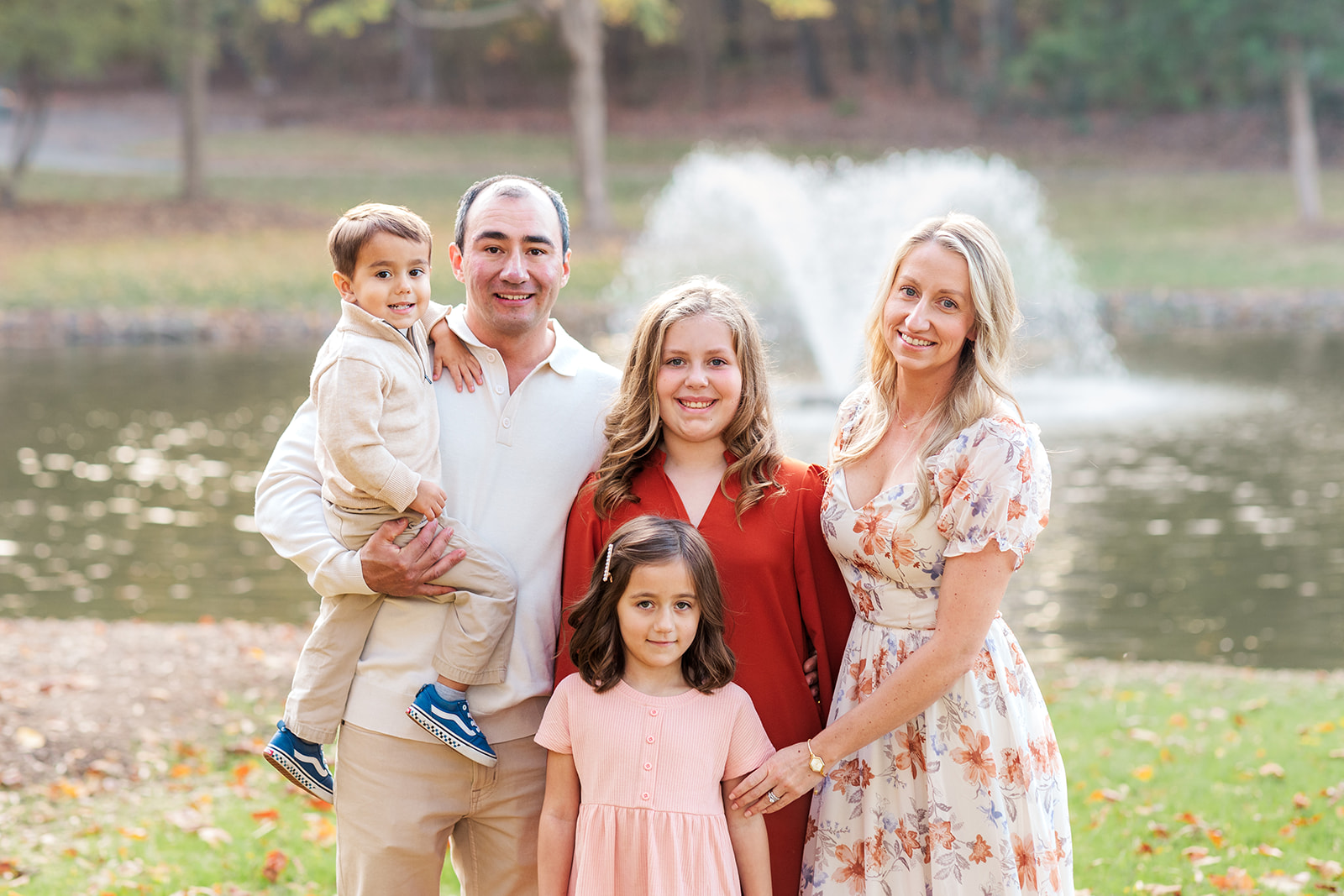 family portrait with vibrant fall foliage