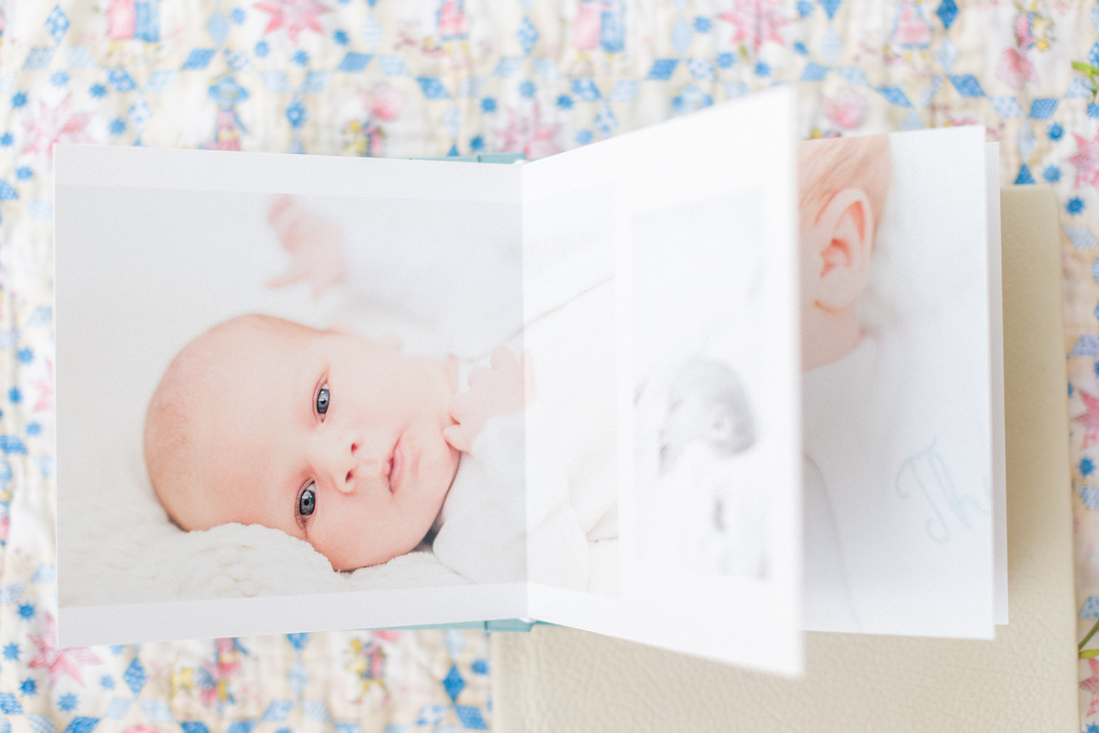 Custom blue linen heirloom album with baby’s first portraits