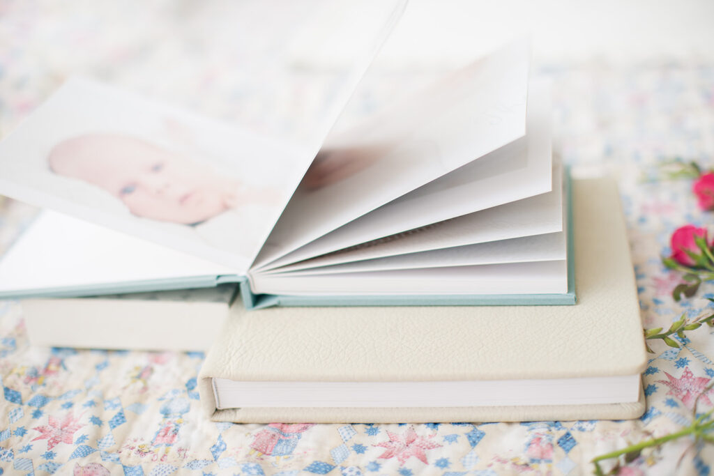 Custom blue linen heirloom album with baby’s first portraits