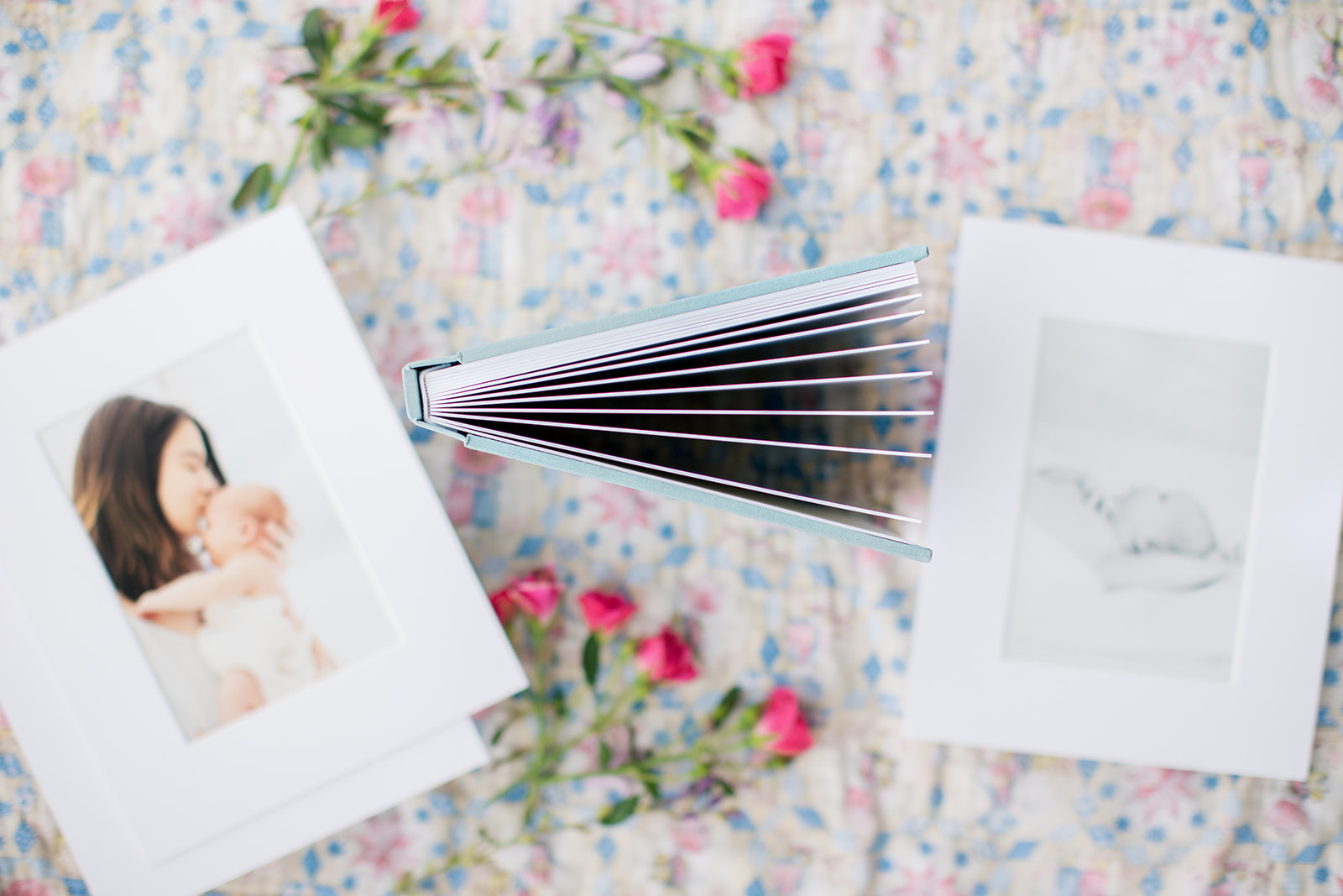 Custom blue linen heirloom album with baby’s first portraits