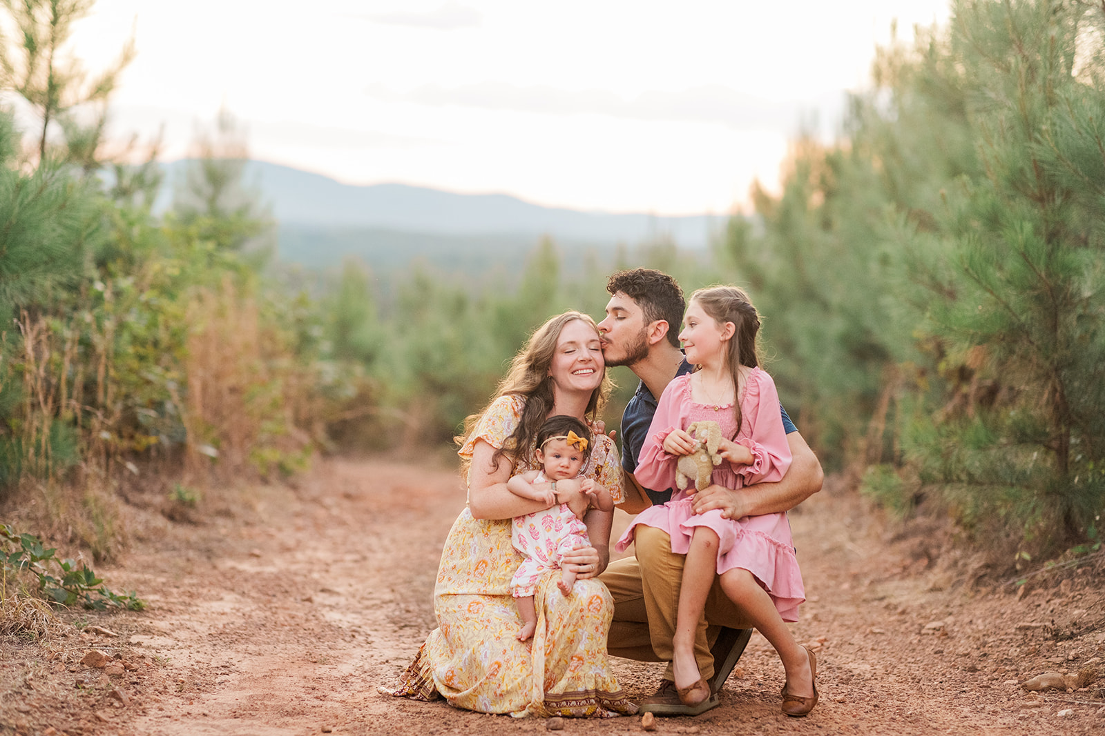 Lifestyle portrait of the Castillo family near their new home in Taylorsville