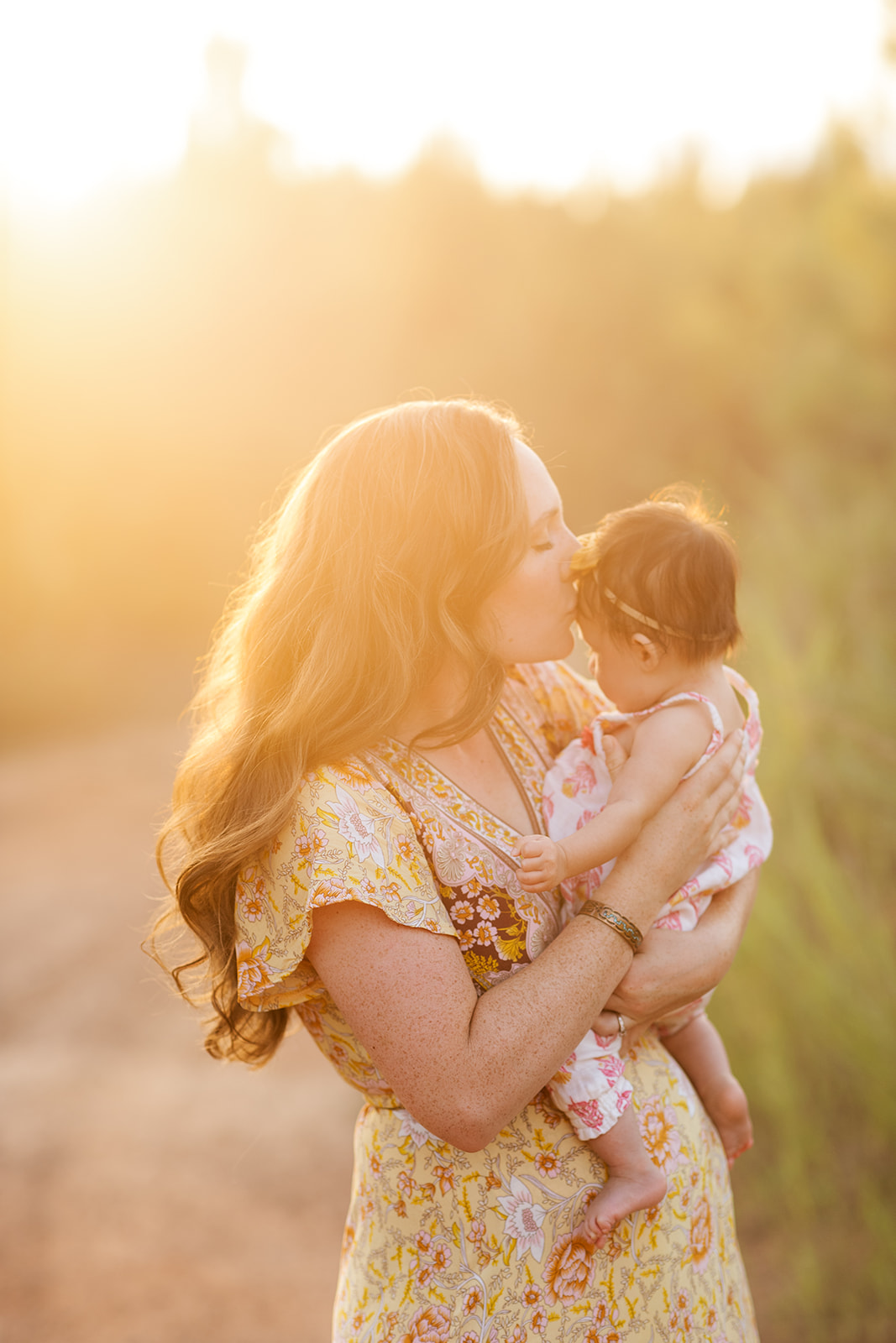 Family photographer capturing sunset photos