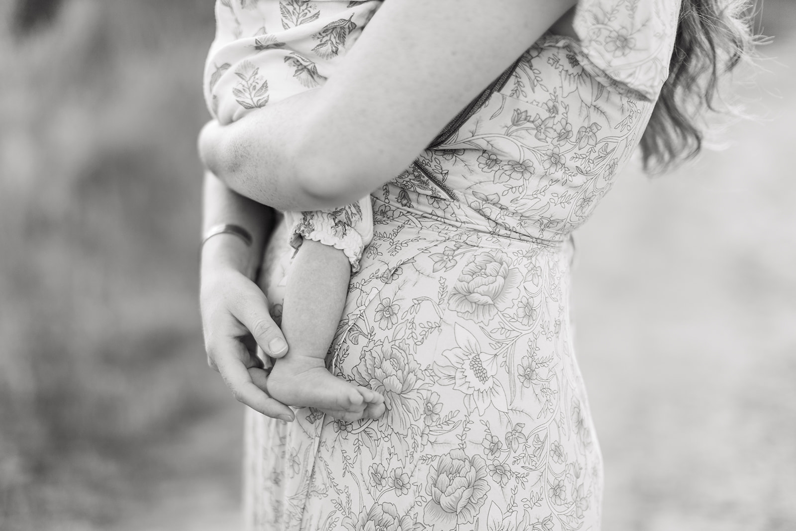 Close-up of baby’s tiny hands during at-home photo session