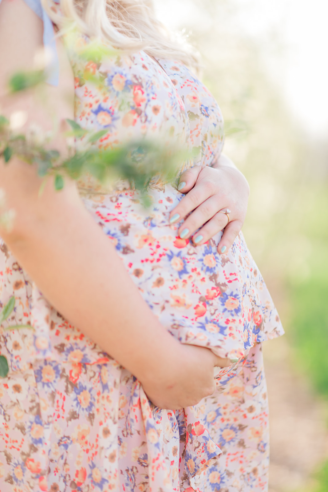 Close-up of baby bump during maternity photo session