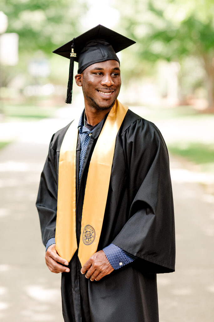 College senior graduation portrait in cap and gown in Charlotte NC