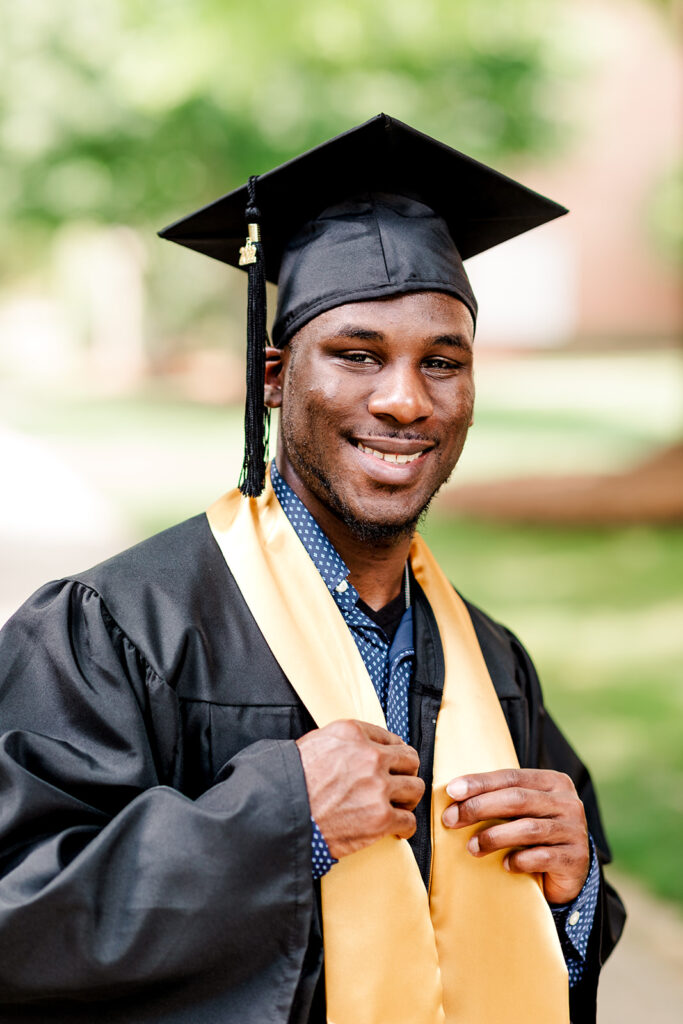 College senior graduation portrait in cap and gown in Charlotte NC