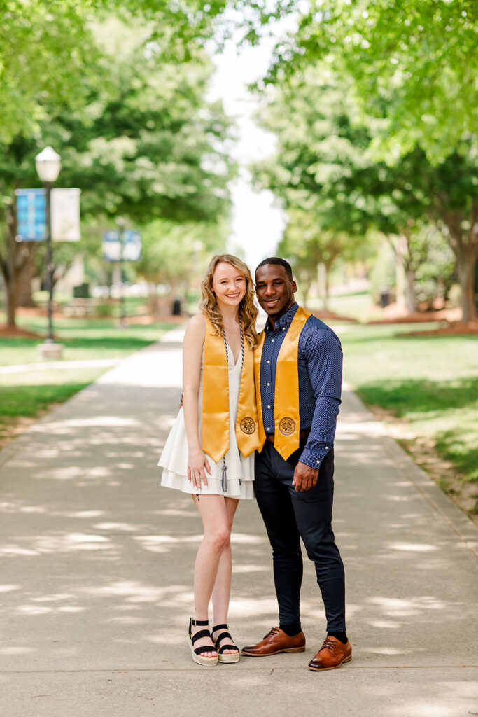 Full-body portrait of graduates