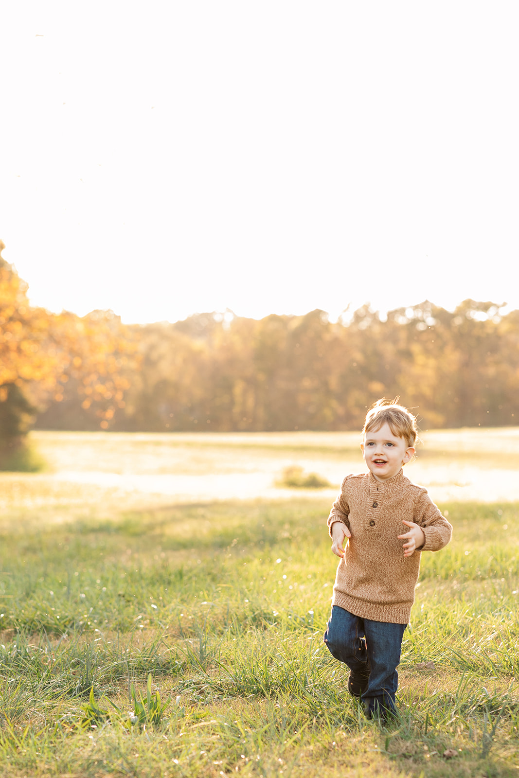 Big brother running in field at murray's mill