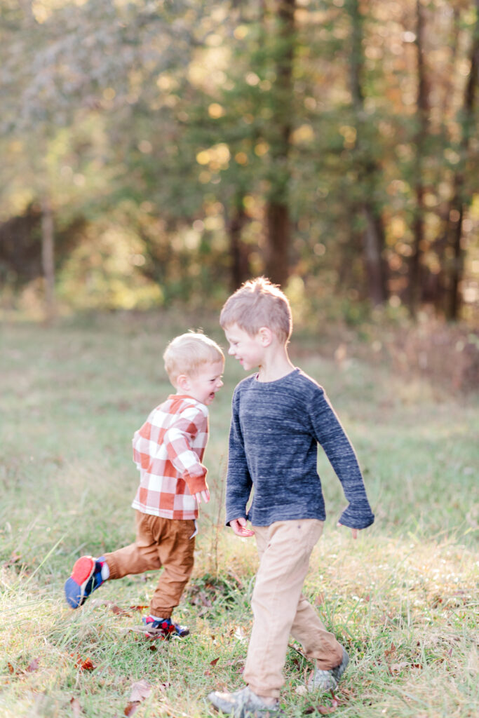 Boys running around in field near Statesville NC. 