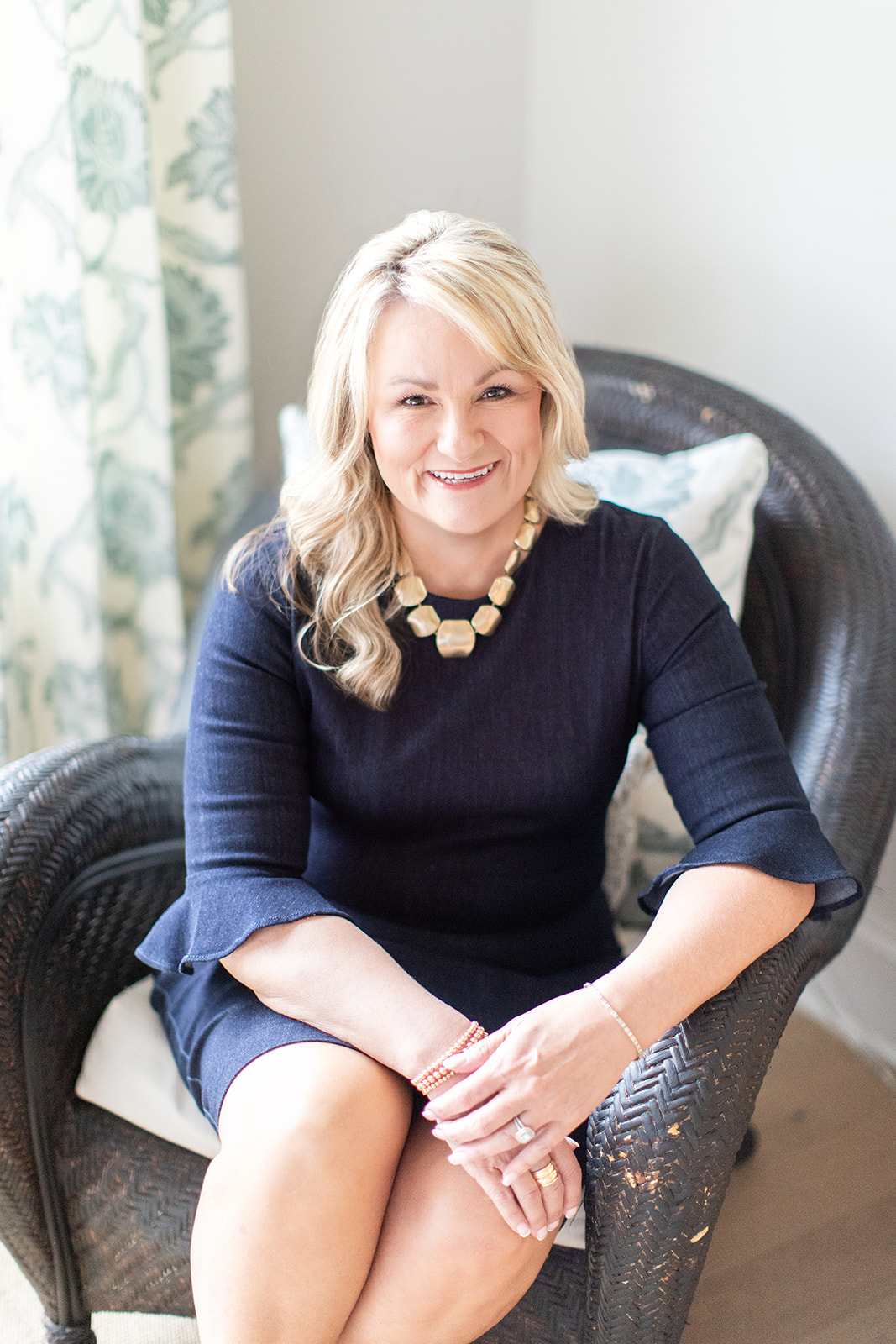 Headshot of Allen Tate Realtor Roxanna Levan in chair in beautiful home near Mooresville, North Carolina.